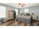 Bright bedroom with wood floors, a ceiling fan, and a neutral color scheme at 1565 Oakridge Dr, Salisbury, NC 28146