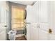 The laundry room features stackable washer/dryer, a window, and built-in cabinets at 1565 Oakridge Dr, Salisbury, NC 28146