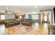 Open-concept living space with modern flooring, neutral paint, and lots of natural light at 1565 Oakridge Dr, Salisbury, NC 28146