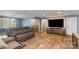 Comfortable living area featuring wood-look floors, a fireplace, and updated trim at 1565 Oakridge Dr, Salisbury, NC 28146