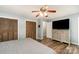 This bedroom offers ample closet space, hard surface floors, and a ceiling fan for added comfort at 1565 Oakridge Dr, Salisbury, NC 28146