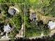 Aerial view of house surrounded by lush greenery, showcasing its location at 16518 Here At Last Ln, Charlotte, NC 28278