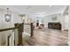 The bonus room features hard wood floors, bar seating, and large windows for natural light at 16518 Here At Last Ln, Charlotte, NC 28278