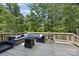 Inviting outdoor deck with comfortable seating and a fire pit, perfect for relaxing or entertaining at 16518 Here At Last Ln, Charlotte, NC 28278