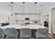 Bright kitchen features a large island with pendant lights, ample cabinet space, and stainless steel appliances at 16518 Here At Last Ln, Charlotte, NC 28278