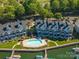 Aerial view of community featuring a pool, docks, and water access at 18723 Vineyard Point Ln, Cornelius, NC 28031