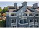 Stunning condo with multiple decks and a view of the neighborhood's lovely landscaping at 18723 Vineyard Point Ln, Cornelius, NC 28031