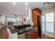 Open kitchen featuring granite countertops, stainless steel appliances and wooden cabinetry at 18723 Vineyard Point Ln, Cornelius, NC 28031