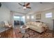 Bright and spacious living room featuring a balcony and stylish, comfortable furnishings at 18723 Vineyard Point Ln, Cornelius, NC 28031