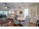Open-concept living space with dining area, stylish furnishings, and views of the outdoors at 18723 Vineyard Point Ln, Cornelius, NC 28031