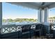Enjoy beautiful lake views from this patio with outdoor furniture and chairs at 18723 Vineyard Point Ln, Cornelius, NC 28031