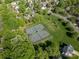 Aerial view of the community tennis courts surrounded by lush green trees at 18723 Vineyard Point Ln, Cornelius, NC 28031