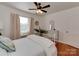 Inviting bedroom with a white bed, hardwood floors, and natural light, creating a calming atmosphere at 216 Wakefield Dr # B, Charlotte, NC 28209