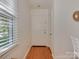 Bright entryway featuring hardwood floors and natural light from the window at 216 Wakefield Dr # B, Charlotte, NC 28209