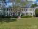 Charming two-story brick building with black shutters and landscaped front yard at 216 Wakefield Dr # B, Charlotte, NC 28209