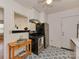 A kitchen featuring white cabinets, stainless steel appliances, patterned flooring and a breakfast bar at 216 Wakefield Dr # B, Charlotte, NC 28209