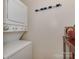 Functional laundry area with stacked washer and dryer and convenient storage at 216 Wakefield Dr # B, Charlotte, NC 28209