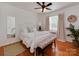 Comfortable main bedroom with a bed, bench, rug, and natural light coming from a window at 216 Wakefield Dr # B, Charlotte, NC 28209