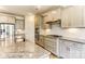 Large kitchen with stainless appliances, range hood, stone counters, subway tile backsplash at 2237 Tabor Rd # 585, Sherrills Ford, NC 28673
