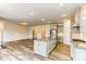 Open concept kitchen has a large island, stainless appliances, and wood flooring at 2237 Tabor Rd # 585, Sherrills Ford, NC 28673