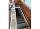 Basement stairs leading to unfinished storage space at 240 North Ave, Troutman, NC 28166