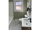 Well-lit bathroom featuring a white vanity, and tiled floors at 240 North Ave, Troutman, NC 28166