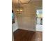 Inviting dining area featuring a stylish light fixture and hardwood flooring at 240 North Ave, Troutman, NC 28166