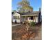 Lovely single-story home with a covered porch and charming architectural details at 240 North Ave, Troutman, NC 28166