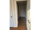 Hallway showcasing refinished hardwood flooring, doors and neutral paint at 240 North Ave, Troutman, NC 28166