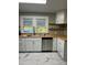 Updated kitchen with stainless steel appliances, butcher block counters, and white cabinetry at 240 North Ave, Troutman, NC 28166