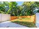 Spacious backyard featuring a combination of wood and white fencing, offering privacy at 2505 Elon St, Charlotte, NC 28208