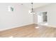 Open-concept dining area with hardwood floors and natural light, leading to a patio at 2505 Elon St, Charlotte, NC 28208