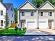 A modern new construction duplex with a well-manicured lawn and a convenient driveway at 2505 Elon St, Charlotte, NC 28208