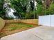A well kept backyard with a newly installed fence and concrete patio at 2507 Elon St, Charlotte, NC 28208