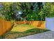 The serene backyard features a newly installed fence, offering privacy and security for outdoor activities and relaxation at 2507 Elon St, Charlotte, NC 28208
