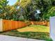 A spacious backyard features a newly installed fence, providing privacy and security for outdoor activities and relaxation at 2507 Elon St, Charlotte, NC 28208