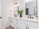 Elegant bathroom featuring double sinks, modern fixtures, and a contemporary design at 2507 Elon St, Charlotte, NC 28208