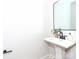 Bright bathroom featuring a stylish pedestal sink, modern fixtures, and neutral decor at 2507 Elon St, Charlotte, NC 28208