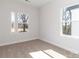 Bright bedroom with two windows, carpet, and neutral walls at 2507 Elon St, Charlotte, NC 28208