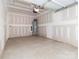 Spacious garage with concrete floor and unfinished drywall at 2507 Elon St, Charlotte, NC 28208