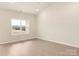 Bright and spacious bedroom featuring light-colored walls, wood floors, and a scenic view window at 3338 Strong Box Ln, Gastonia, NC 28052