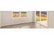 Bright living room with an exit to the patio, light-colored walls and wood floors at 3338 Strong Box Ln, Gastonia, NC 28052