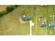 Stunning aerial view of a home with a long driveway, surrounding greenery, outbuildings, and ample space for outdoor activities at 3648 Plainfield Dr, Shelby, NC 28150