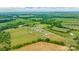 Stunning aerial view of homes in a lush, green, countryside, featuring diverse landscapes and a serene atmosphere at 3648 Plainfield Dr, Shelby, NC 28150