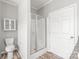 A clean bathroom with a glass-enclosed shower, toilet, and vanity, designed for comfort and convenience at 3648 Plainfield Dr, Shelby, NC 28150