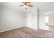 Spacious bedroom with neutral paint, carpet flooring, and a door leading to another room at 3648 Plainfield Dr, Shelby, NC 28150