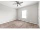 Bright bedroom featuring neutral carpet, a ceiling fan, and a window providing natural light at 3648 Plainfield Dr, Shelby, NC 28150