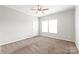 Comfortable bedroom featuring two windows, neutral carpet, and fresh paint at 3648 Plainfield Dr, Shelby, NC 28150