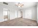 Spacious bedroom with ceiling fan, carpet, and access to the bathroom and closet at 3648 Plainfield Dr, Shelby, NC 28150