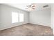 Bedroom with ceiling fan, carpet, and large windows for natural light at 3648 Plainfield Dr, Shelby, NC 28150